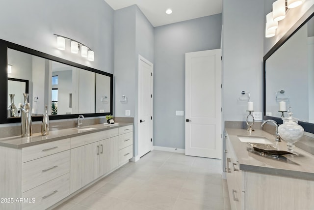 bathroom with tile patterned floors and vanity