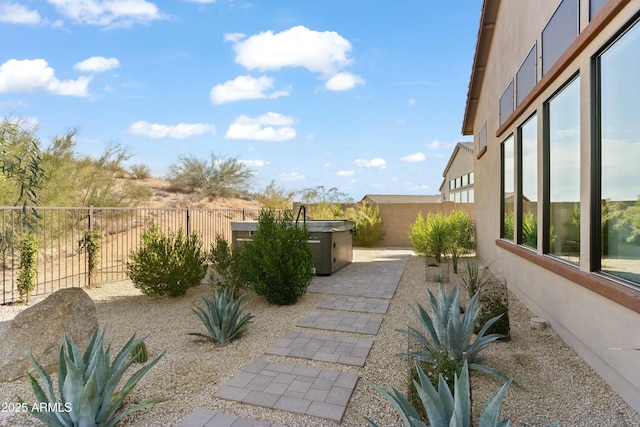 view of yard with a hot tub