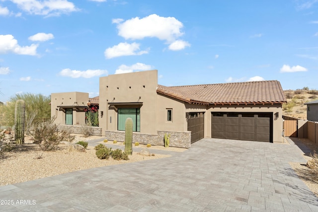 southwest-style home with a garage