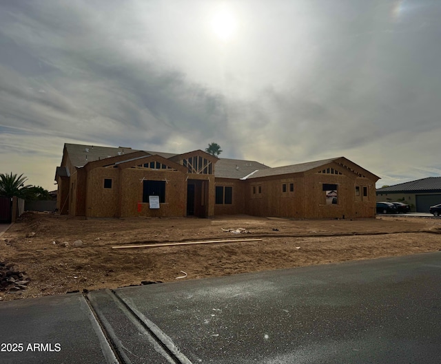 unfinished property featuring stucco siding