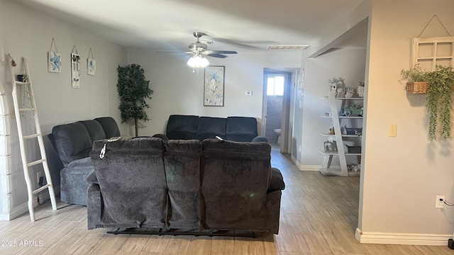 living room with ceiling fan