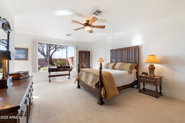 bedroom with a ceiling fan, light colored carpet, and visible vents