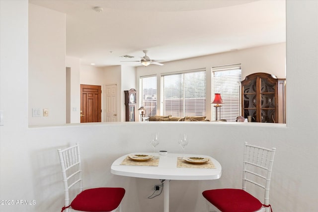 interior space featuring ceiling fan