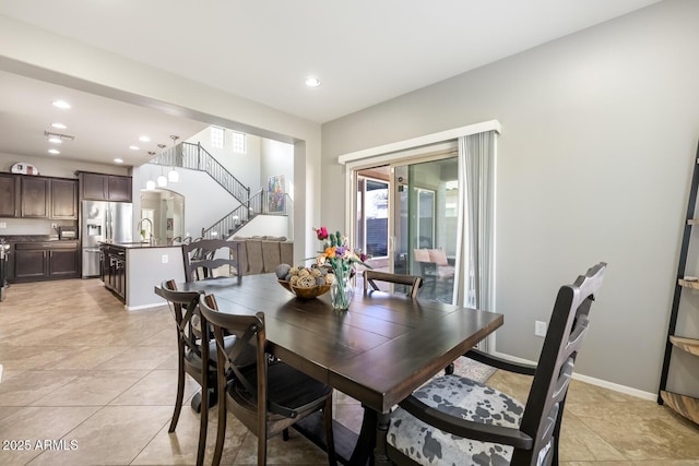 10840 W Saddlehorn Rd, Peoria, AZ 85383 - dining space featuring sink and light tile patterned floors