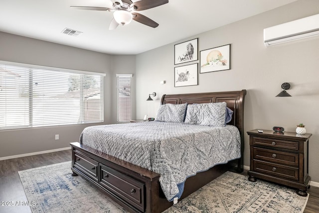 10840 W Saddlehorn Rd, Peoria, AZ 85383 - bedroom featuring ceiling fan, dark wood-type flooring, and a wall unit AC