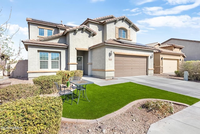 view of front of house featuring a garage and a front yard