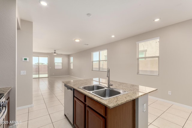 14355 W Valentine St, Surprise, AZ 85379 - kitchen with ceiling fan, a sink, a kitchen island with sink, stainless steel appliances, and light tile patterned floors