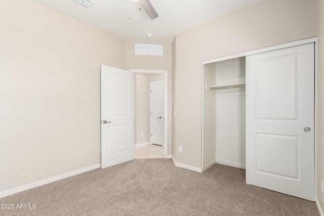 14355 W Valentine St, Surprise, AZ 85379 - unfurnished bedroom featuring visible vents, a closet, light carpet, baseboards, and ceiling fan