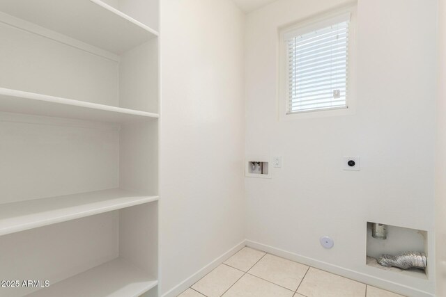 14355 W Valentine St, Surprise, AZ 85379 - laundry room featuring laundry area, light tile patterned flooring, baseboards, hookup for a washing machine, and electric dryer hookup