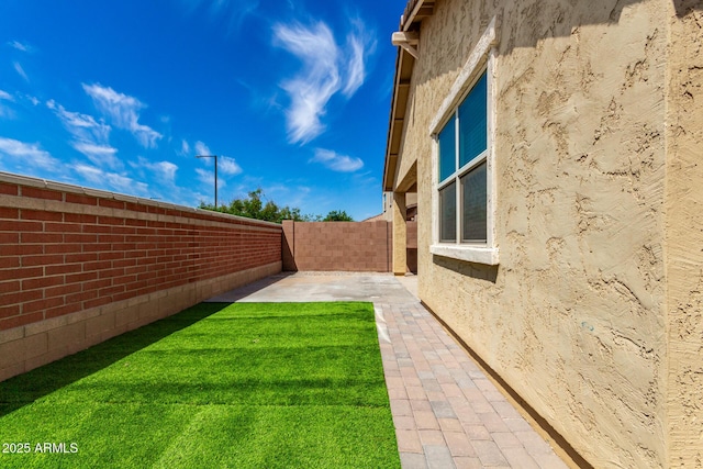 14355 W Valentine St, Surprise, AZ 85379 - view of yard featuring a patio and a fenced backyard