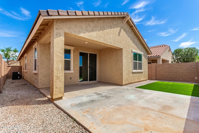 14355 W Valentine St, Surprise, AZ 85379 - rear view of house with central AC, a fenced backyard, a patio area, and stucco siding