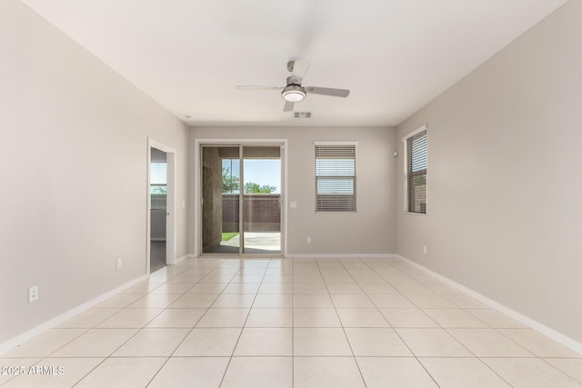 14355 W Valentine St, Surprise, AZ 85379 - empty room with baseboards, ceiling fan, light tile patterned floors, and visible vents