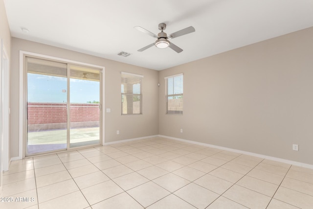 14355 W Valentine St, Surprise, AZ 85379 - empty room featuring light tile patterned floors, ceiling fan, visible vents, and baseboards