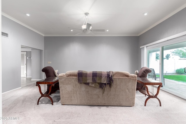 living area with ornamental molding, visible vents, carpet flooring, and a ceiling fan