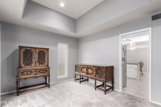 living area featuring light carpet, recessed lighting, visible vents, and baseboards