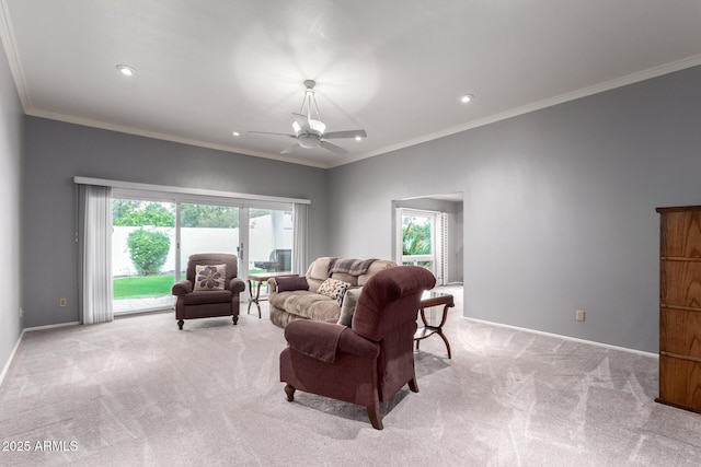 living area featuring carpet floors, crown molding, and baseboards