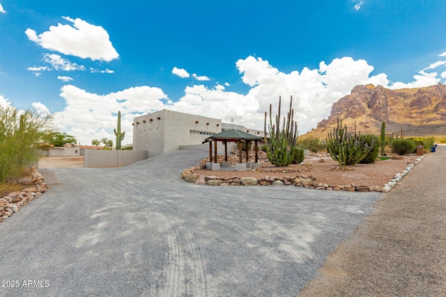 5736 E Singletree St, Apache Junction, AZ 85119 - pueblo-style home featuring a gazebo, a mountain view, and stucco siding