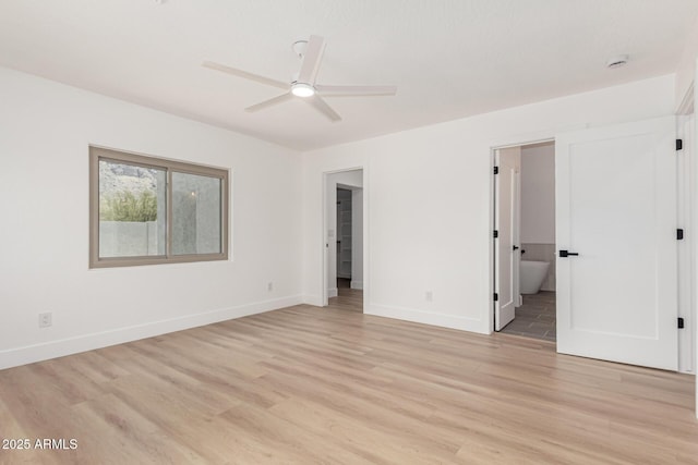 5736 E Singletree St, Apache Junction, AZ 85119 - unfurnished bedroom with light wood finished floors and ensuite bath