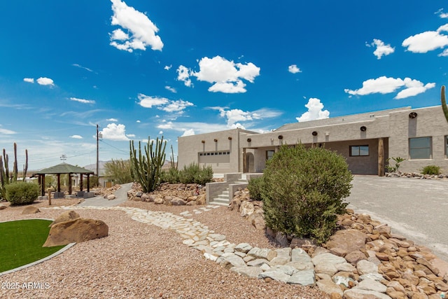 5736 E Singletree St, Apache Junction, AZ 85119 - view of front of house with a gazebo, stucco siding, and an attached garage