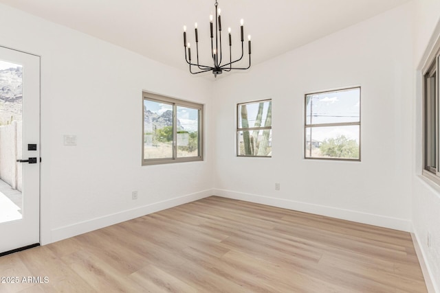 5736 E Singletree St, Apache Junction, AZ 85119 - unfurnished dining area with a chandelier and light wood-style floors