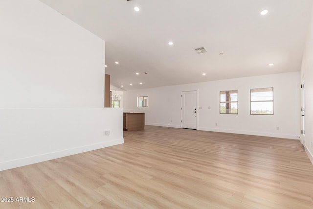 5736 E Singletree St, Apache Junction, AZ 85119 - unfurnished living room with recessed lighting, light wood-type flooring, and lofted ceiling