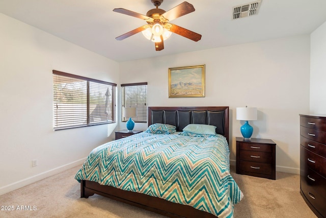 bedroom with ceiling fan and light colored carpet