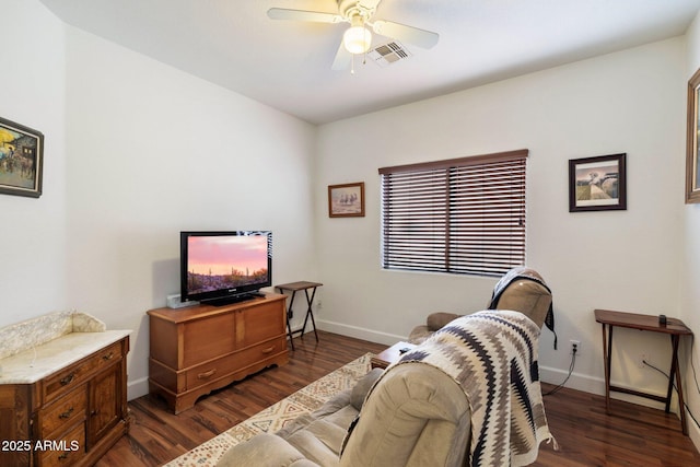 living room with ceiling fan and dark wood-type flooring