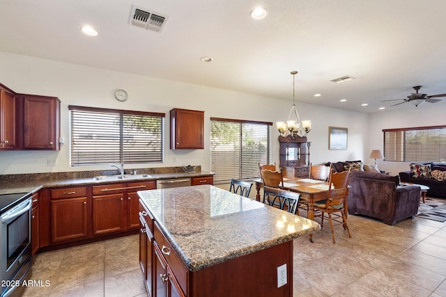 kitchen with electric range, dishwasher, sink, decorative light fixtures, and a kitchen island