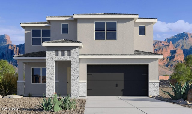 view of front of house with a mountain view and a garage