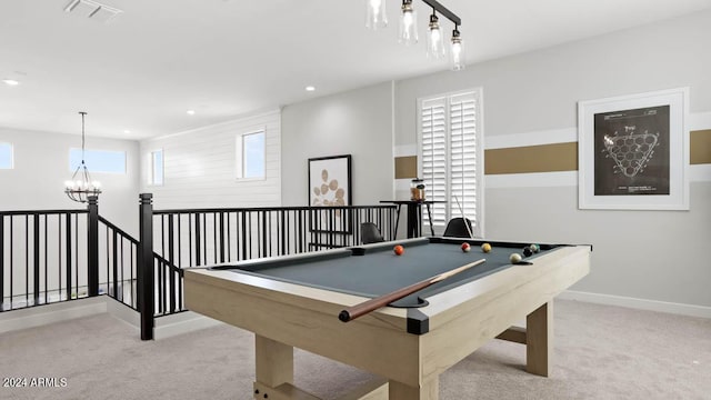 recreation room featuring light colored carpet, an inviting chandelier, plenty of natural light, and billiards