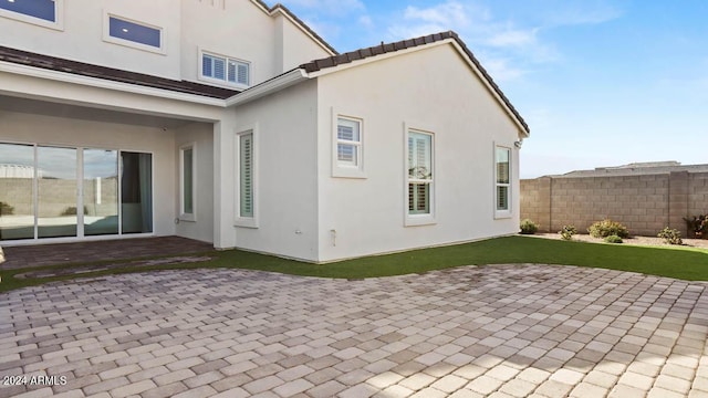 rear view of property featuring a patio