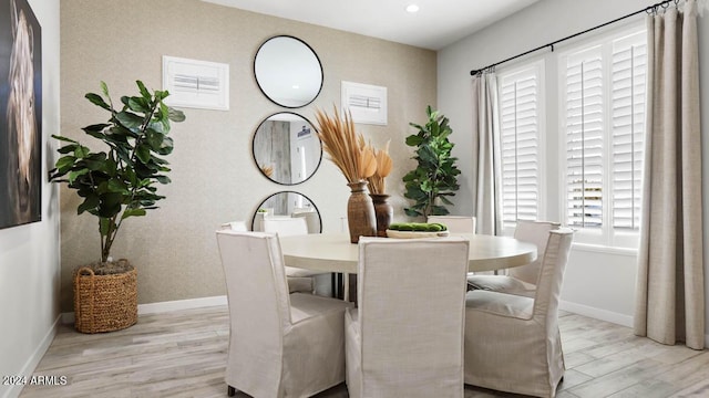 dining space featuring light hardwood / wood-style floors