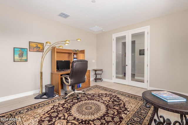 office featuring hardwood / wood-style flooring and french doors