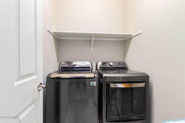 clothes washing area with independent washer and dryer