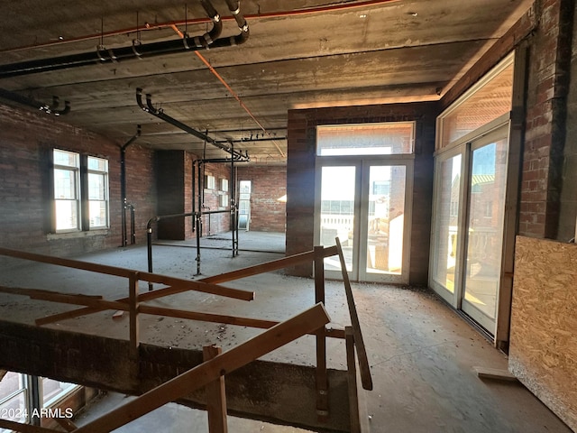 interior space with french doors and plenty of natural light