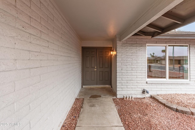 entrance to property with brick siding