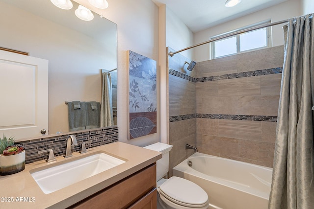 bathroom with decorative backsplash, toilet, vanity, and shower / bath combo