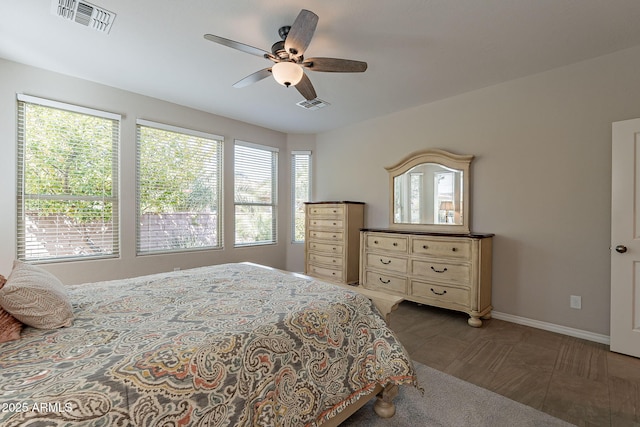 bedroom featuring visible vents, baseboards, and ceiling fan