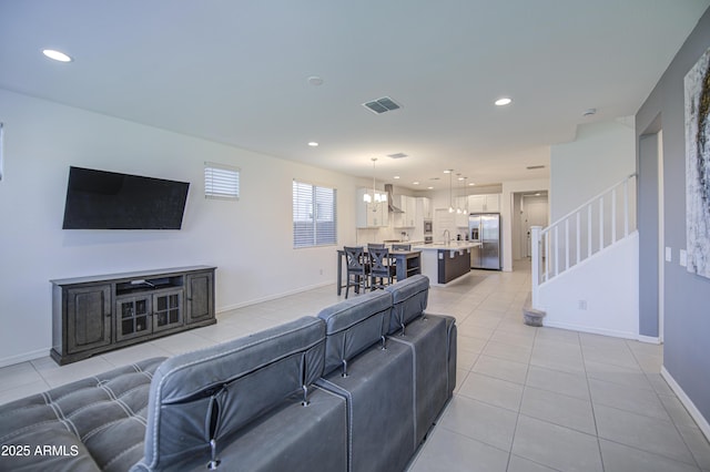 5621 W Chuck Box Rd, Laveen, AZ 85339 - living area featuring light tile patterned flooring, recessed lighting, and stairs