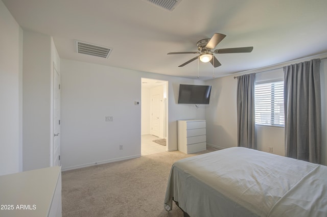 5621 W Chuck Box Rd, Laveen, AZ 85339 - bedroom with light carpet, a ceiling fan, and ensuite bathroom