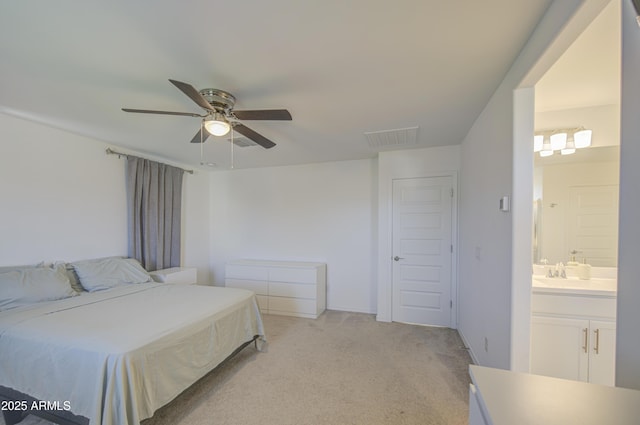5621 W Chuck Box Rd, Laveen, AZ 85339 - bedroom with light carpet, a ceiling fan, and ensuite bath