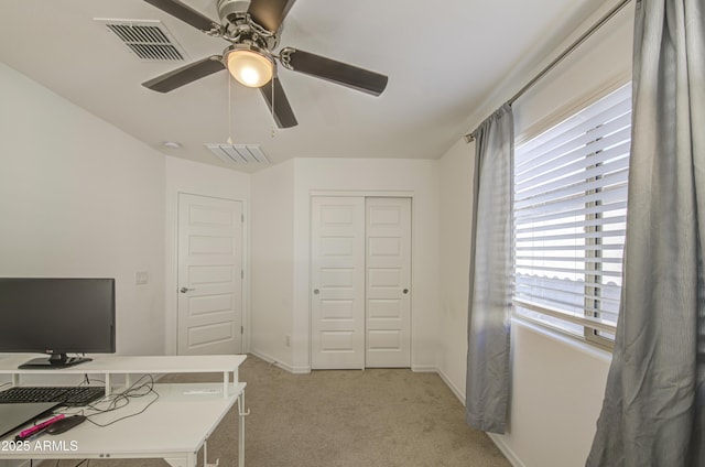 5621 W Chuck Box Rd, Laveen, AZ 85339 - home office with light carpet and ceiling fan