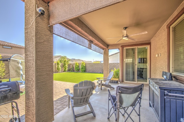 5621 W Chuck Box Rd, Laveen, AZ 85339 - fenced backyard with ceiling fan and a patio