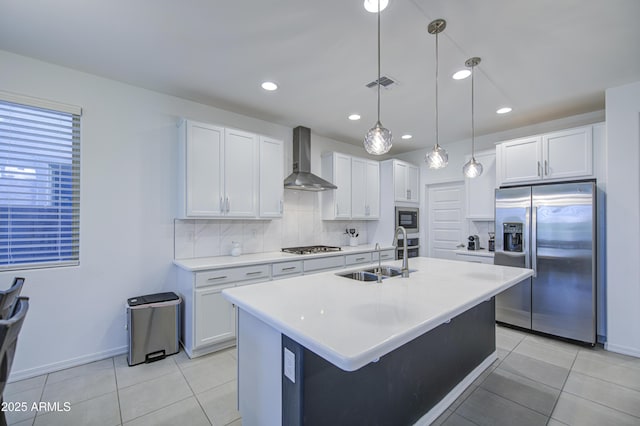 5621 W Chuck Box Rd, Laveen, AZ 85339 - kitchen featuring stainless steel appliances, wall chimney exhaust hood, light tile patterned floors, white cabinetry, and recessed lighting