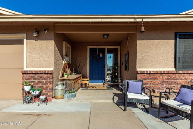 doorway to property with a patio area