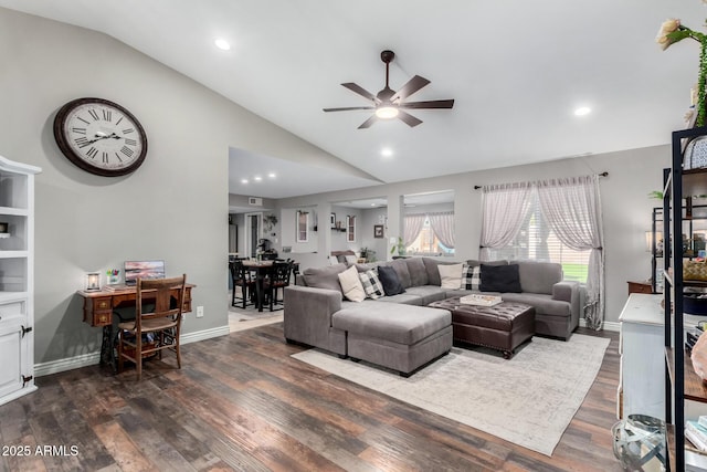 living room featuring ceiling fan, dark hardwood / wood-style floors, and high vaulted ceiling