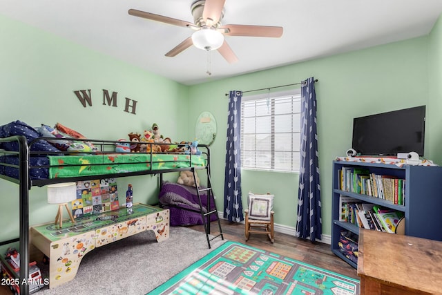 bedroom with ceiling fan and wood-type flooring