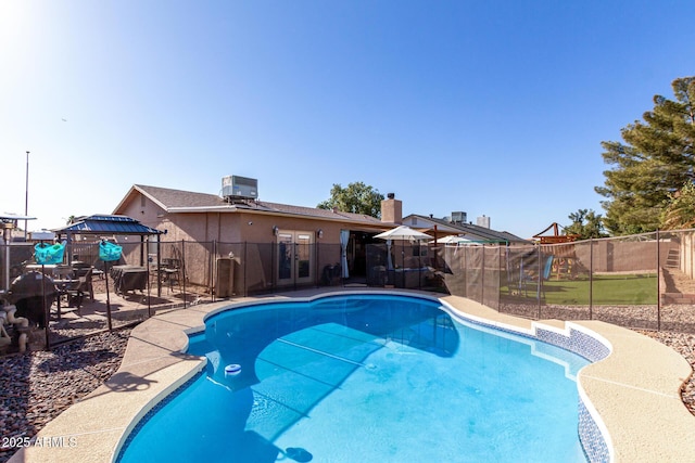 view of swimming pool featuring a gazebo and central AC