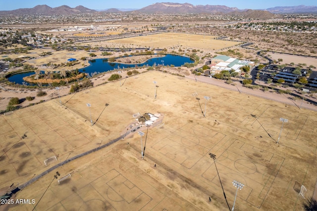 bird's eye view with a water and mountain view