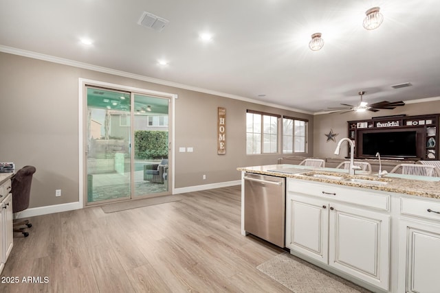 1179 E Regent Dr, Gilbert, AZ 85298 - kitchen with dishwasher, a sink, baseboards, ornamental molding, and light wood finished floors